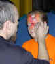Face Painting: Small picture of Lorna being painted by Olivier Zegers.